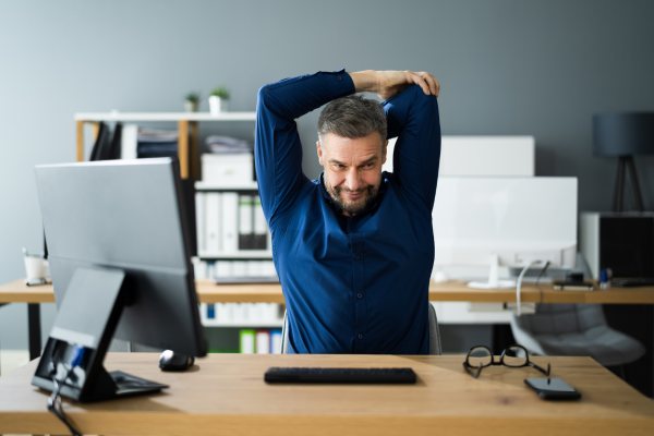 5 Desk Stretches You Can Do Right Now to Relieve Lower Back Pain